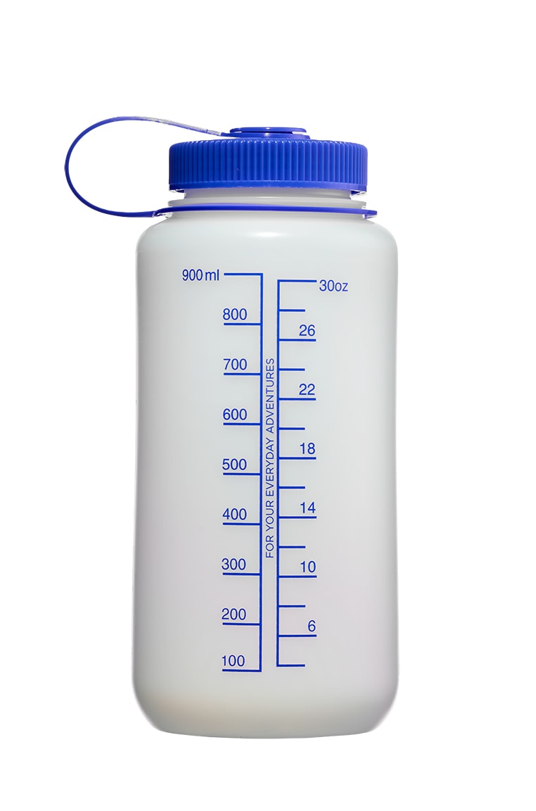 The 32oz Wide Mouth Ultralite Bottle comes in white with a blue lid and displays measurement markings in milliliters and ounces.