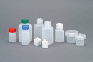 The Medium Travel Kit includes nine assorted plastic bottles with colored caps and two clear containers, displayed on a gray background.