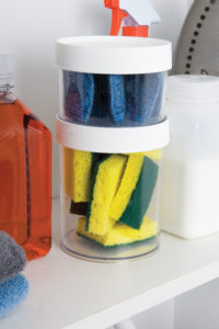 Two 32oz Storage Jars with white lids are filled with blue and yellow cleaning sponges and neatly placed on a shelf.
