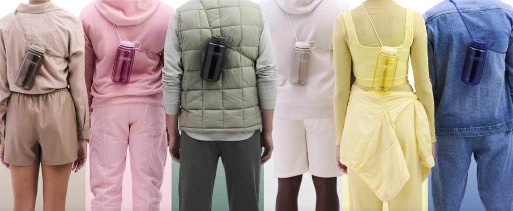 Six people in colorful outfits, each with a water bottle strapped across their back with a sling.