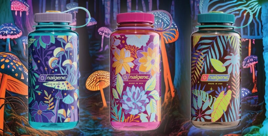 Three colorful Nalgene bottles with floral designs set against a glowing, fantasy mushroom forest background.