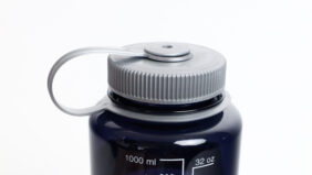 A close-up of the 32oz Wide Mouth Large Logo reusable water bottle with a gray screw cap and side measuring scale.