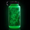The 32oz Wide Mouth Surrealist Bottle glows green with a black lid and handle against a dark background.