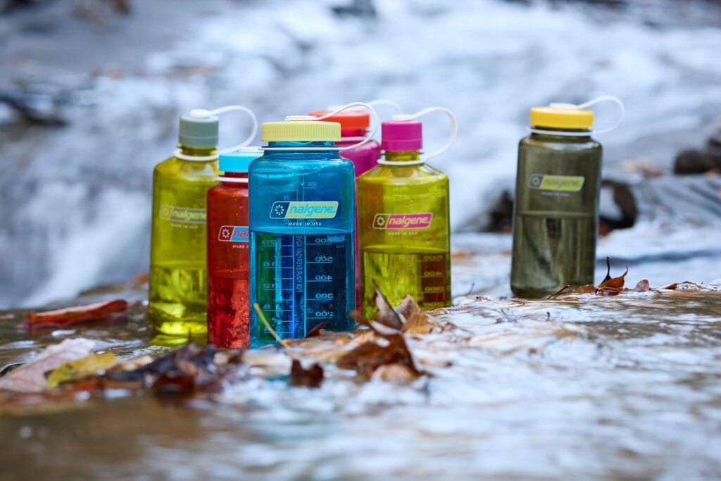 bright and colorful nalgene bottle in the ice
